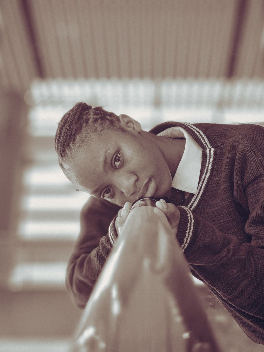 Thoughtful teenage student in school uniform, depression in teenagers Kenya